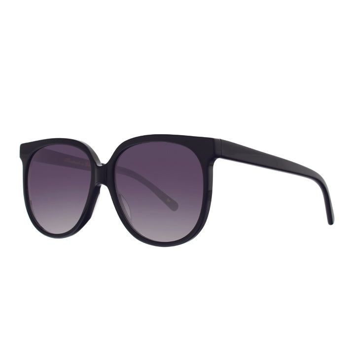 Angled view of big black sunglasses with round gradient lenses.