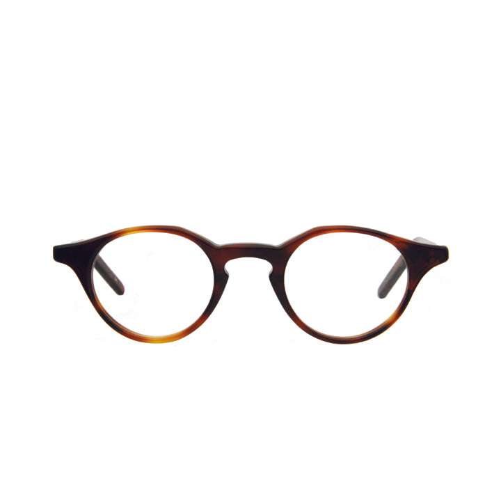 Side view of a pair of round full frame eyeglasses in tortoise color pattern with keyhole bridge and clear lenses.