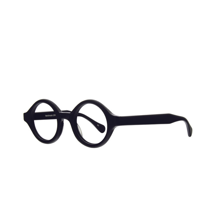 A pair of thick black, perfectly round eyeglasses with a saddle bridge, tapered temples, and clear lenses.