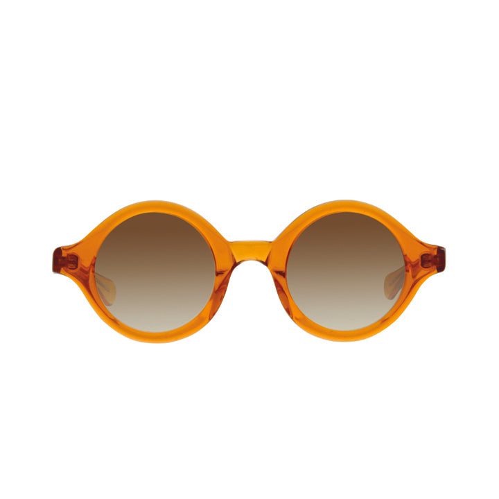 A pair of orange, perfectly round sunglasses with a saddle bridge, tapered temples, and gray colored lenses.