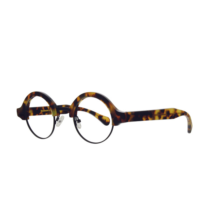 A pair of perfectly round combination eyeglasses with adjustable nose pads, thick tortoise accents on black metal, and clear lenses.