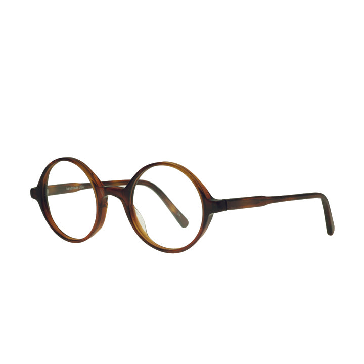 A pair of round eyeglasses made from acetate in a tortoise color pattern.