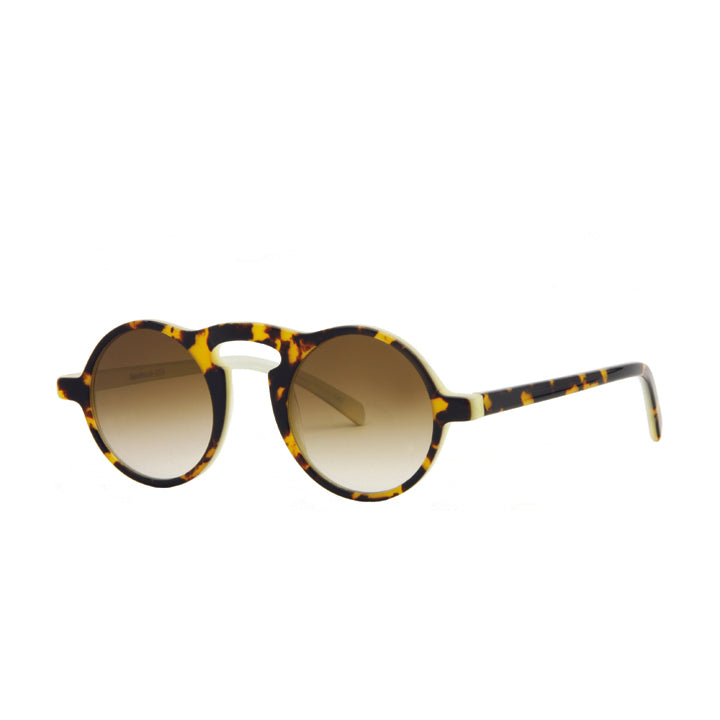 Side angle view of unique round full frame sunglasses with a high brow bridge, made of acetate, in a Tokyo tortoise color pattern.