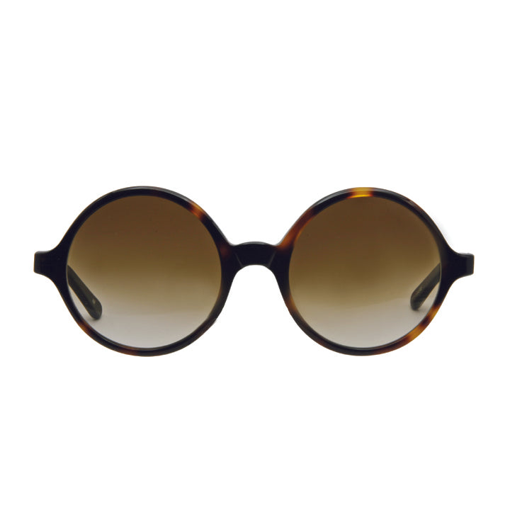 A pair of round full frame sunglasses made of acetate, in a tortoise color pattern, with brown lenses.
