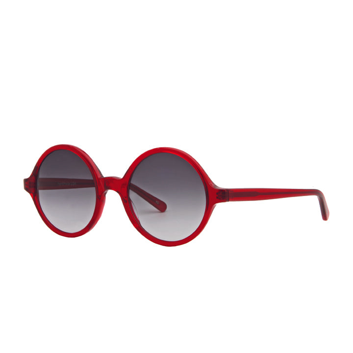 A pair of perfectly round full frame large sunglasses with saddle bridge, featuring gray lenses in translucent red color.