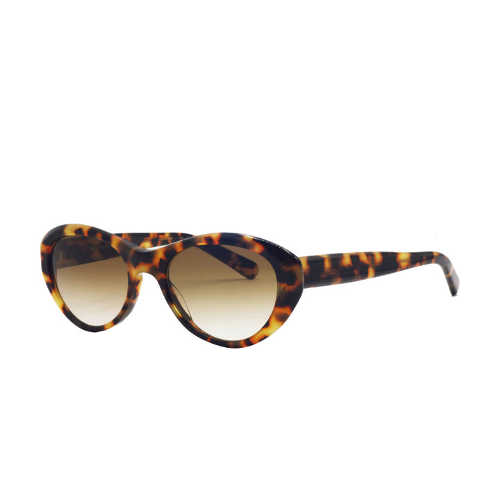 A pair of large cat eye sunglasses with saddle bridge, featuring brown lenses in tortoise pattern.