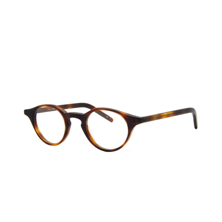 Side view of a pair of round full frame eyeglasses in tortoise color pattern with keyhole bridge and clear lenses.