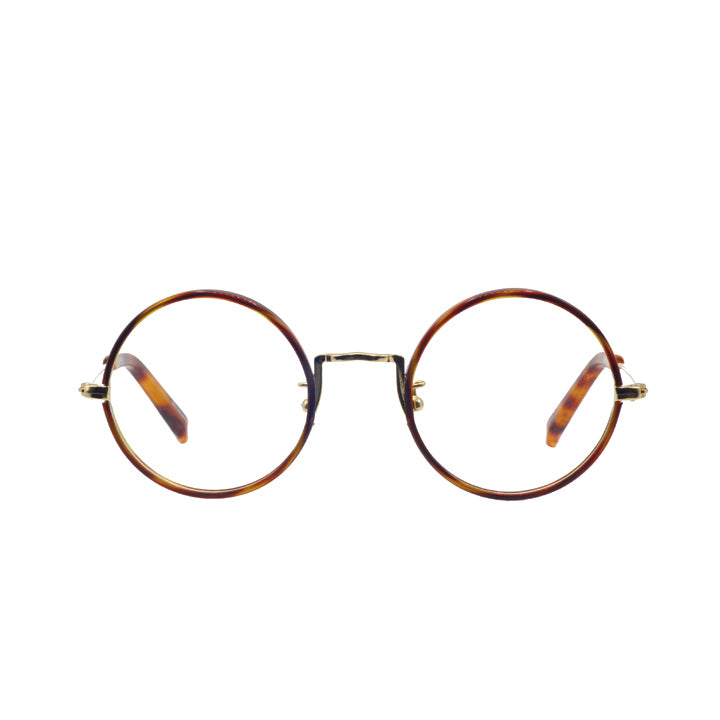 A pair of round full frame metal eyeglasses with tortoise patterned rim and temples.
