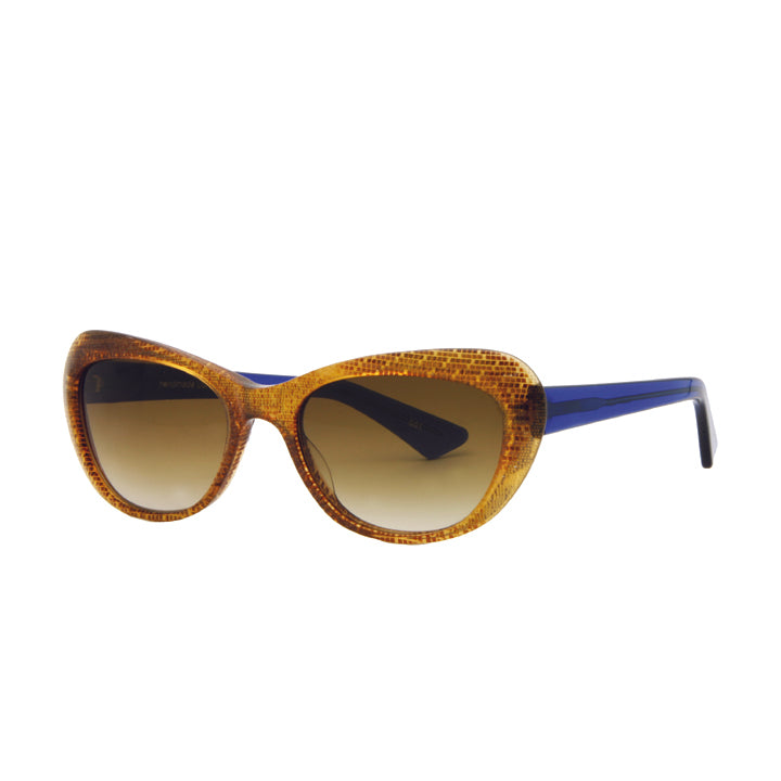 Side view of neutral gold snakeskin cat eye sunglasses with blue temple.